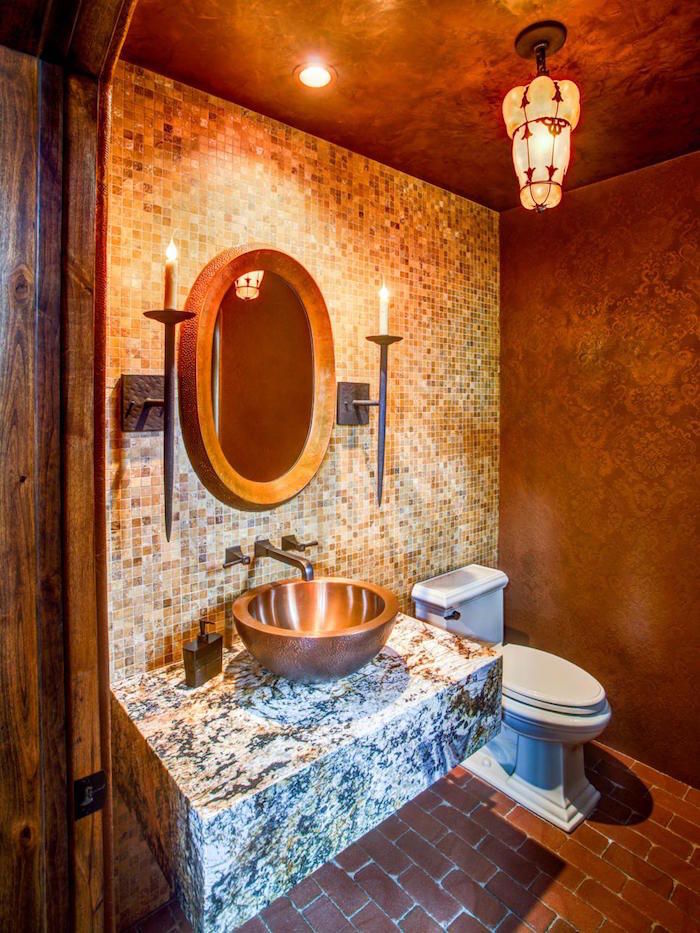 toilettes rustique avec mur en faience et lavabo en cuivre et support en marbre