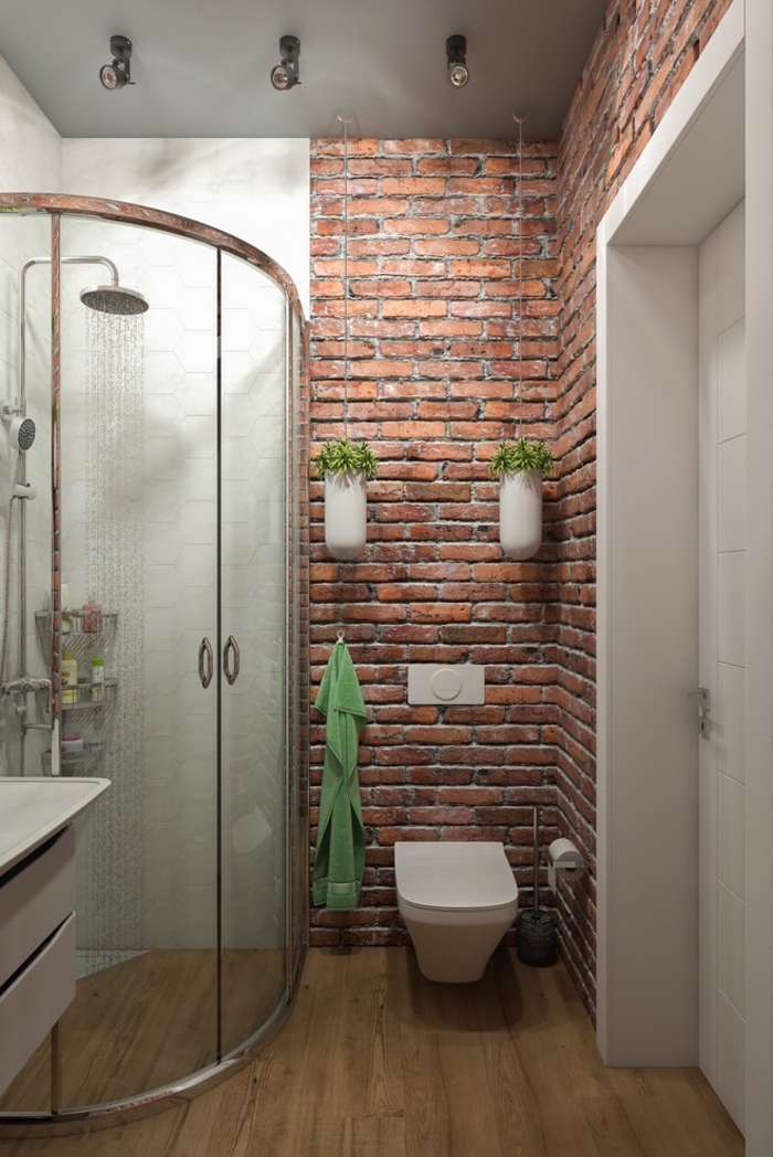 aménagement petite salle de bain et douche à l'italienne d'angle avec porte arrondie