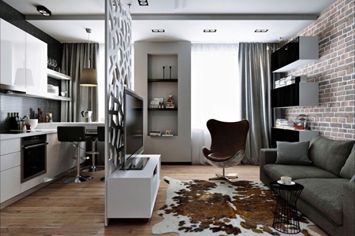 idée séparation espace dans studio en forme de meuble mur en blanc, déco de style moderne et industriel