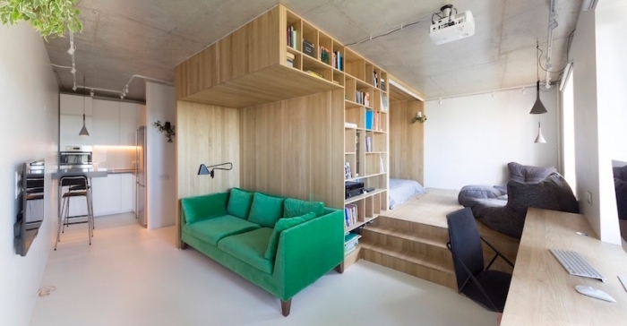 exemple de design intérieur moderne avec cube multifonctions en bois équipé d'espace lit et rangements bibliothéque
