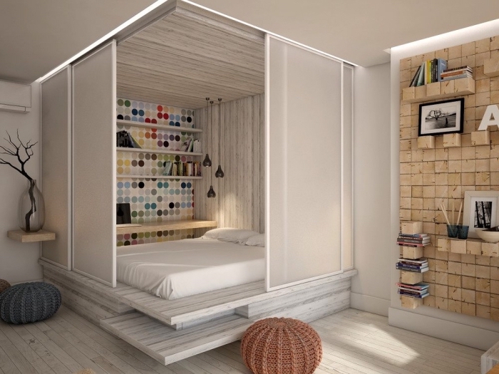 modèle de déco intérieure avec cube multifonctions avec fermeture portes coulissantes pour séparer le lit du salon dans un studio