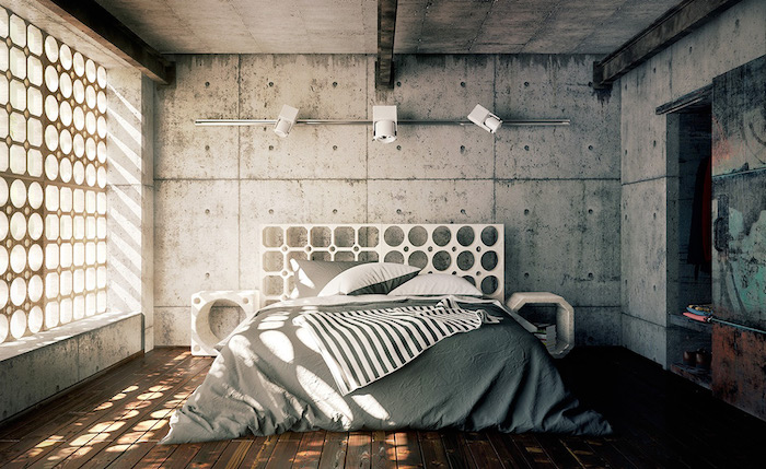 parquet bois marron, linge de lit gris et blanc, murs en béton, poutres métalliques apparentes, sol en bois, tete de lit originale à trous