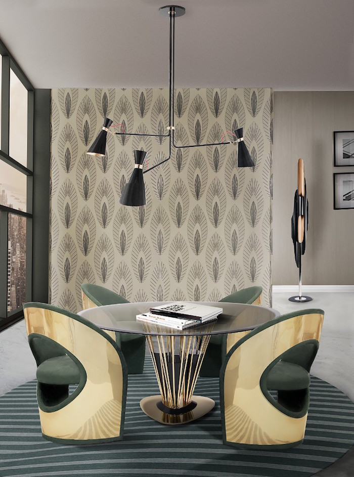 salle à manger design avec meubles de designer style rétro avec table ronde en verre et fauteuils en velours vert et or