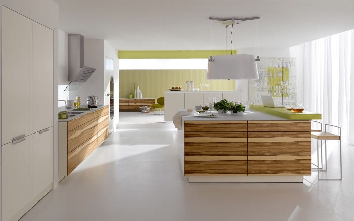 modèle de design intérieur moderne dans une cuisine grande et ouverte équipée avec ilot central blanc et bois