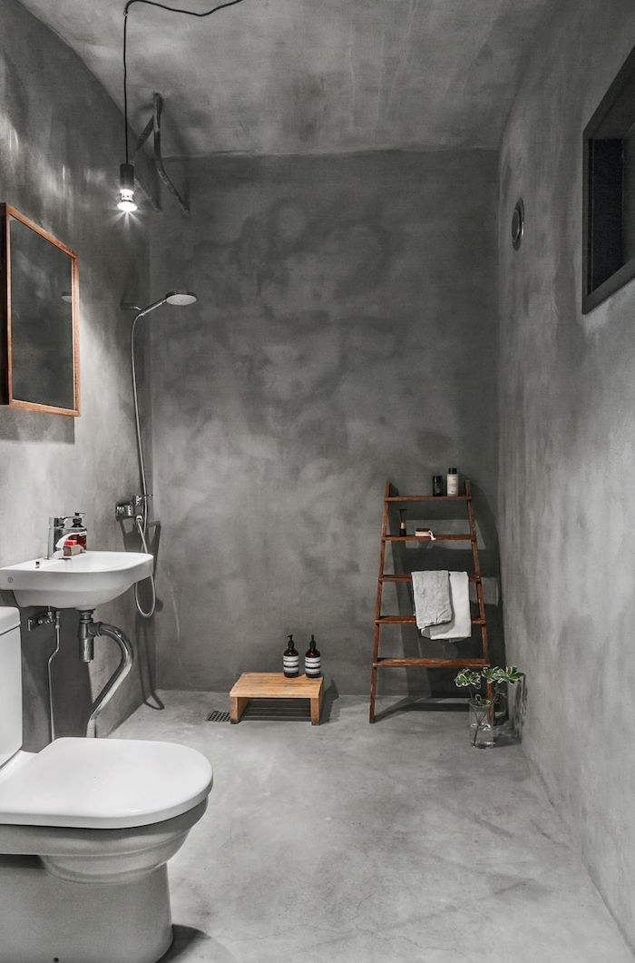 photo de rénovation salle de bain avec sol plafond et mur en béton ciré gris