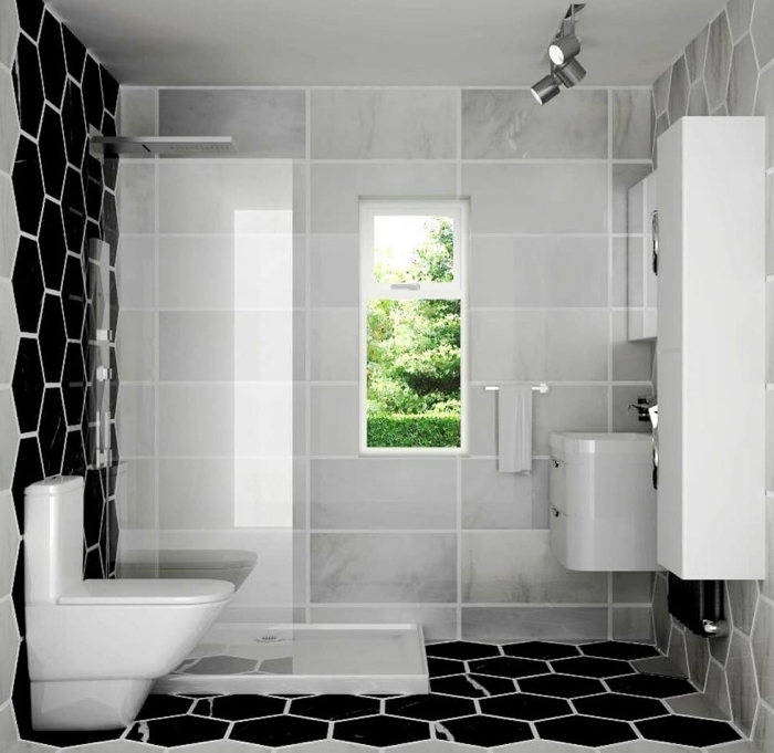 design intérieur moderne en blanc et noir dans une petite salle de bain avec cabine à douche italienne au carrelage gris clair et noir
