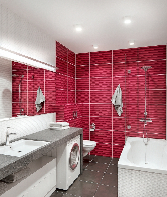 meuble petite salle de bain sous vasque sans poignée avec comptoir gris, revêtement mural en carrelage rose