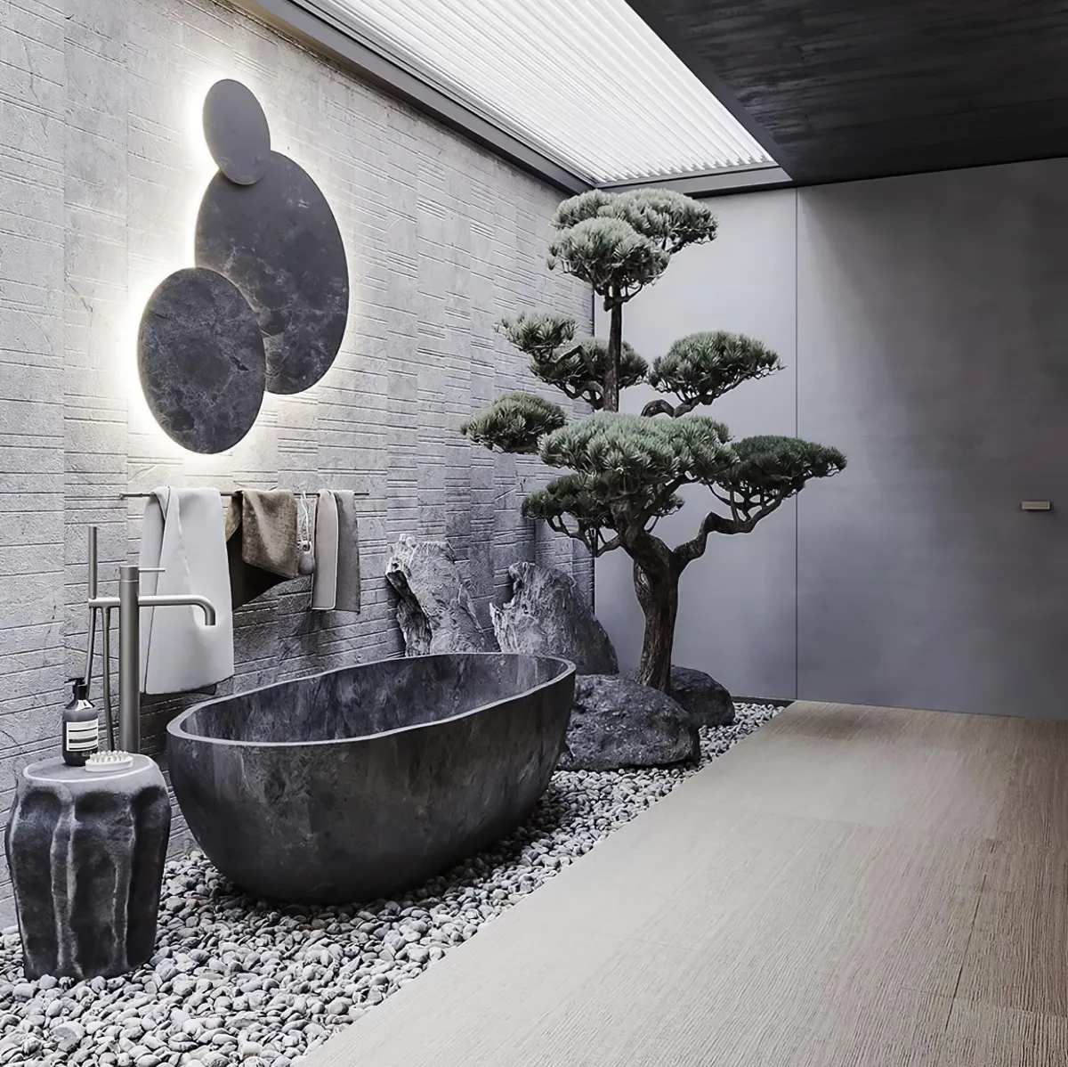 baignoire en perre grise arbre bonsai gravier au pied de la baignoire murs gris clair