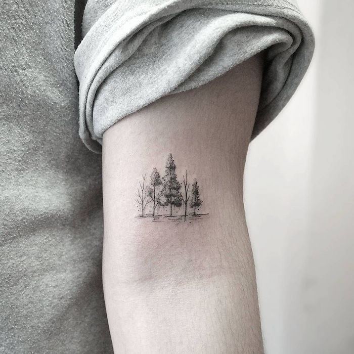 petit tatouage manchette discret paysage arbres en pointillés sur bras homme