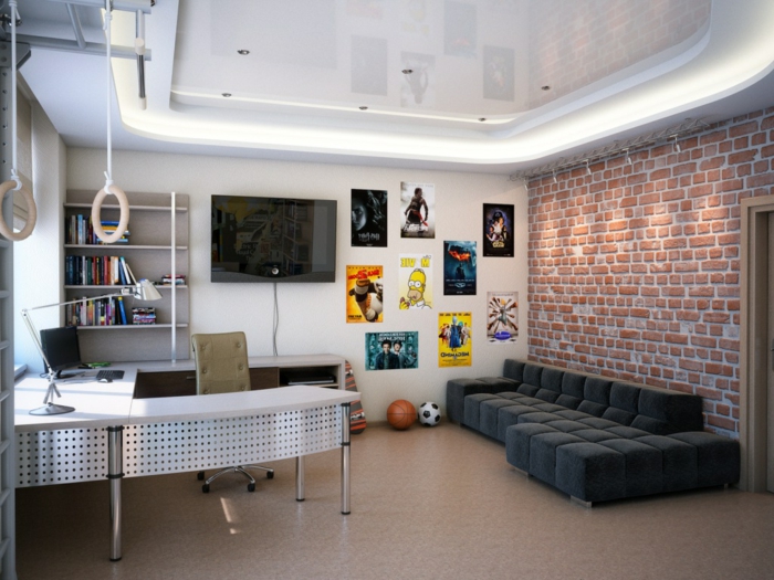 chambre garcon ado style industriel, sofa bas noir, mur en briques, bureau en U, posters muraux et anneaux de gymnastique