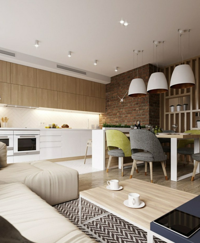 cuisine semi ouverte sur salon avec un petit mur bas, table de repas style scandinave, équipement de cuisine blanc, sofa et table basse