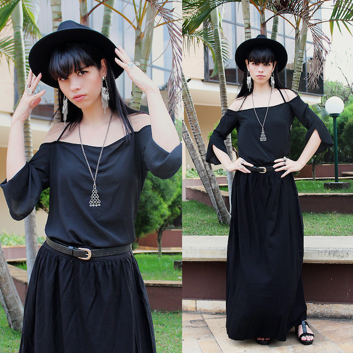 déguisement sorcière halloween en robe noire, capeline noire, collier triangle, boucle d oreille géants, deguisement magicien