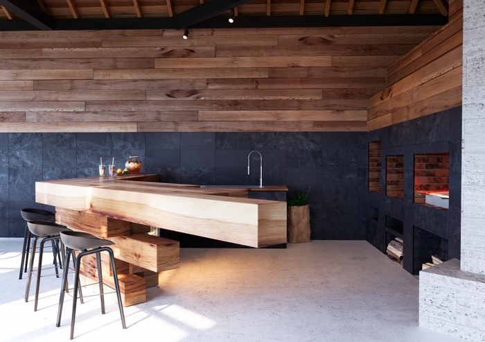 modèle d'îlot central en bois et design ultra original dans une cuisine moderne extérieure avec plafond à poutres apparentes