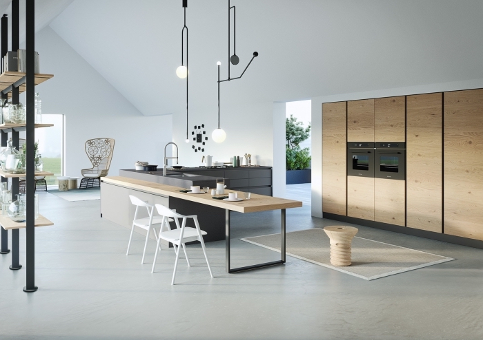design intérieur de style moderne dans une cuisine en u avec îlot en gris et bois, modèle de meuble rangement en bois et fer