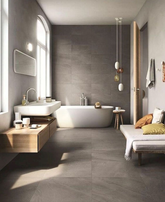 photo grande salle de bain spacieuse avec sol et mur en béton ciré gris banc et grand lavabo scandinave