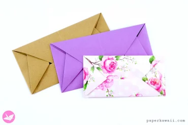 trois enveloppes en origami de différents couleurs et motifs