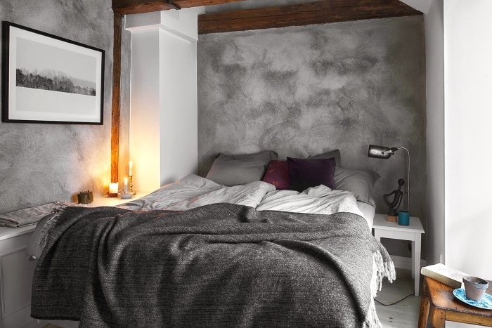 ambiance scandinave dans une chambre peinte en gris quartz, déco cocooning avec meubles en bois, plaid gris anthracite avec franges