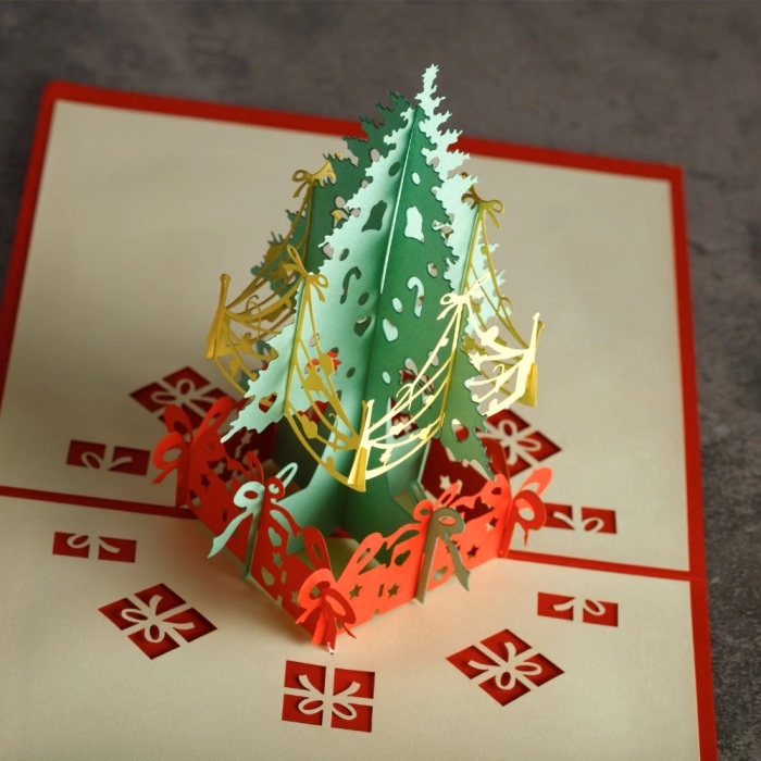 exemple de carte pop up noel avec sapin en papier coloré, modele de carte de voeux à faire soi même avec technique origami