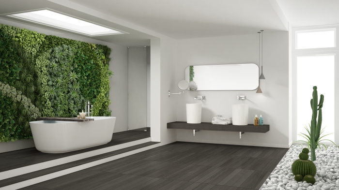 exemple de décoration zen dans une salle de bain spacieuse avec fenêtre de plafond et lumière naturelle, intérieur blanc et gris foncé