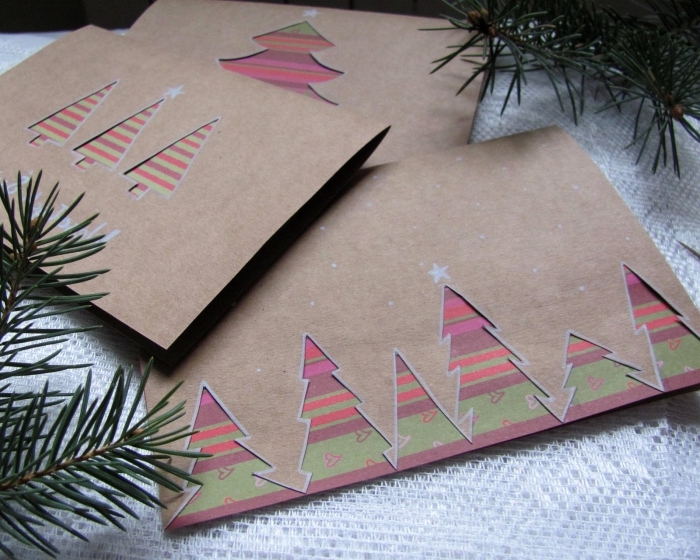 carte de voeux noel en papier kraft brun avec sapins découpés, comment personnaliser une carte Noel en papier cartonné
