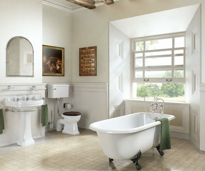 salle de bain blanche aux motifs marron, miroir semi ovale, lavabo colonne sur pied, sol aux carreaux, alcôve fenêtre 