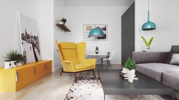design intérieur moderne de style scandinave, déco salon blanc avec parquet clair et canapé gris, modèle de fauteuil couleur jaune moutarde