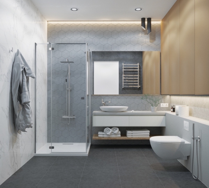 design intérieur moderne, carrelage gris clair pour murs dans une salle de bain contemporaine, cabine de douche en verre