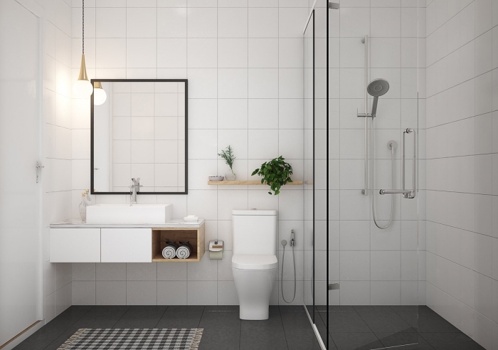 décor salle de bain contemporaine aux murs en carreaux blancs avec plancher gris foncé, idée rangement mural