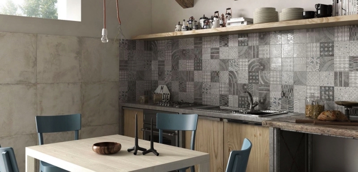 des carreaux de ciment patchwork en nuances de gris qui apportent de l'élégance à la cuisine en bois clair