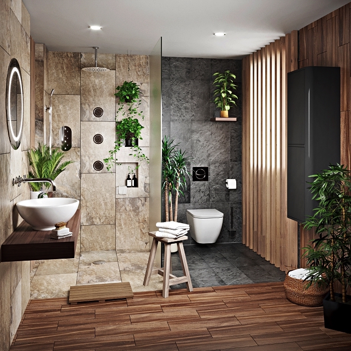 salle de bain de luxe en pierre naturelle avec douche italienne en carrelage gris en harmonie avec l'ambiance reposante et zen 
