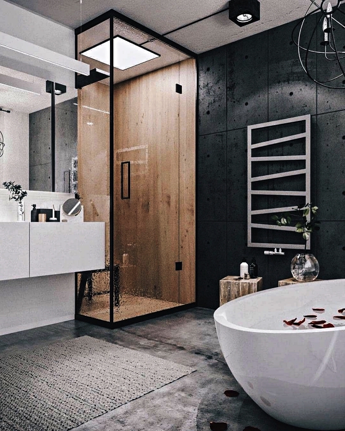 l'espace douche en bois délimité par un paroi vitré minimaliste dans une salle de bain moderne en blanc et noir