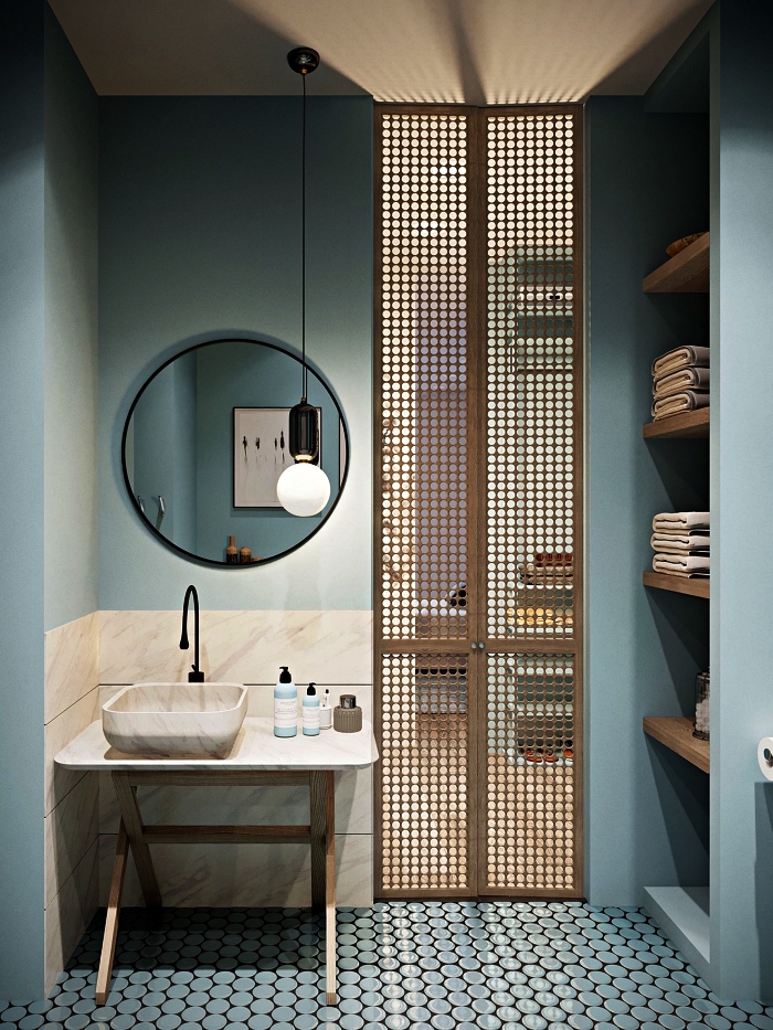 ambiance apaisante dans une salle de bain zen en bleu gris avec crédence imitation pierre naturelle et cloison en bois légère