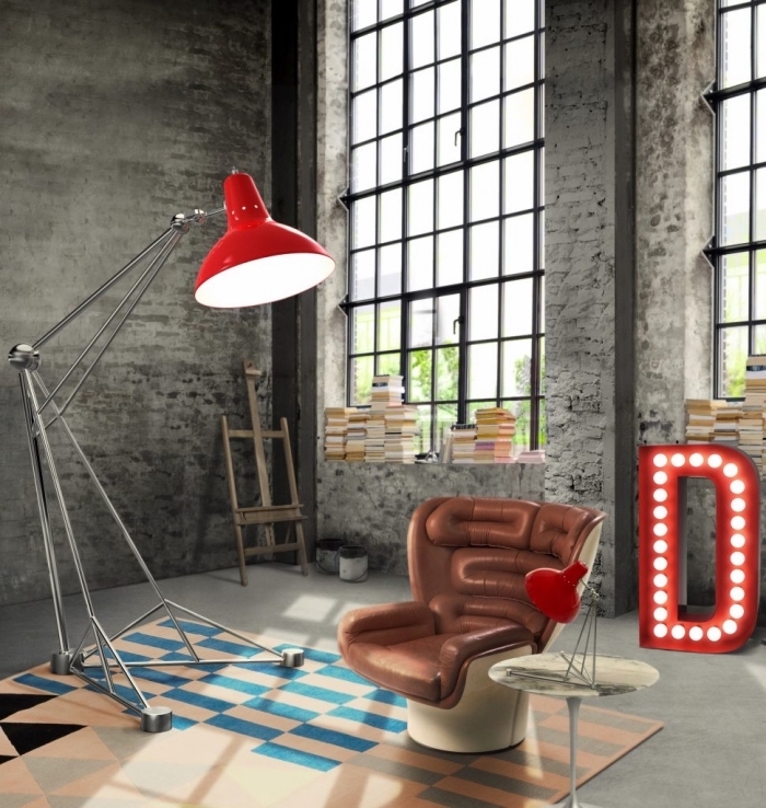 modèle fauteuil design en cuir marron, déco industrielle salon aux murs en briques peintes grises avec objets métal