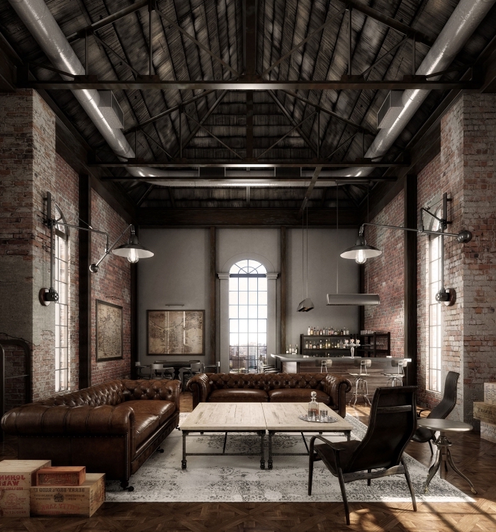 aménagement loft industriel avec plafond poutres apparentes et murs en briques rouges, meuble de salon cuir marron