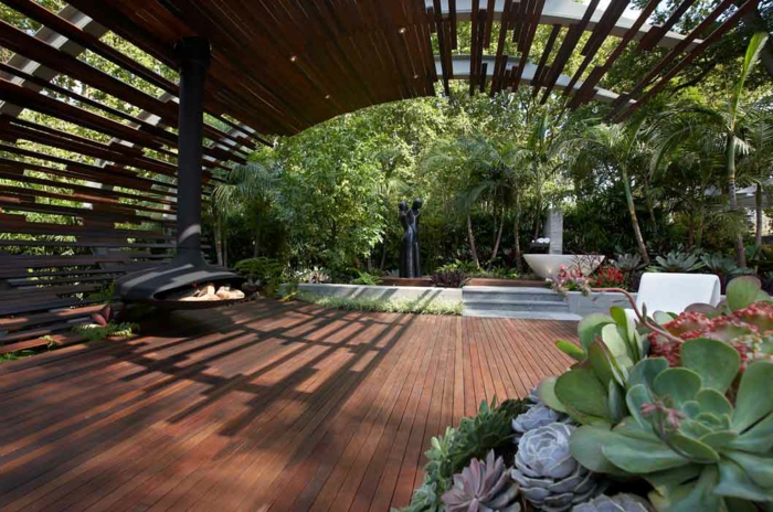 jardin paysager, foyer suspendu, plantes grasses, tonnelle en bois, aménagement paysager minimaliste