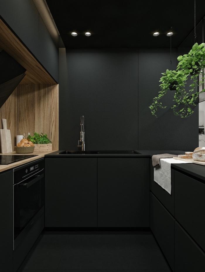 idée plan de travail noir, déco petite cuisine en parallèle, design intérieur moderne dans une petite cuisine noire et bois