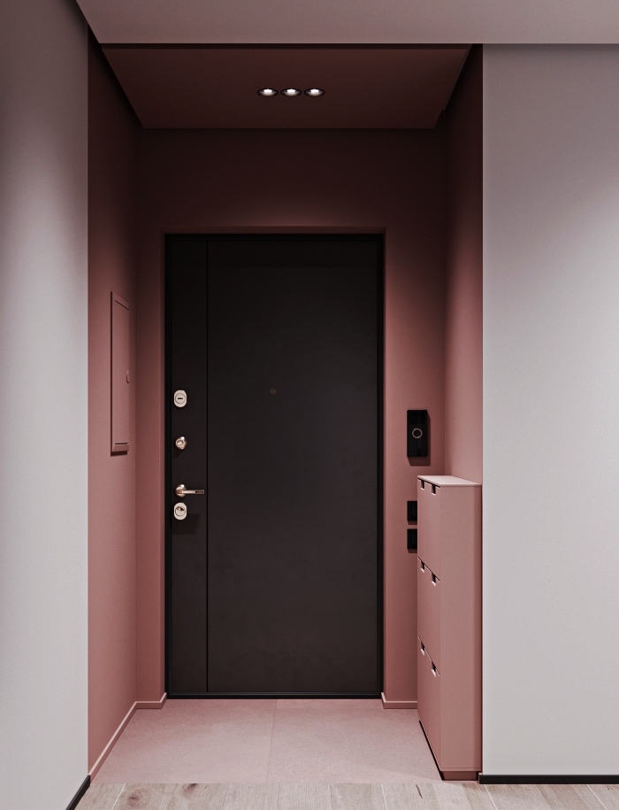 idée peinture couloir et entrée, petite entrée peint en rose poudré contrastant avec la porte d'entrée gris anthracite