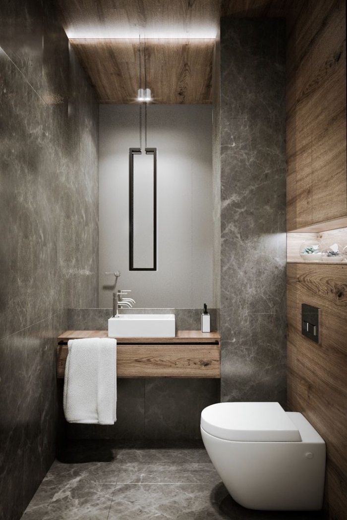décoration toilette de style industriel avec revêtement mural effet bois et ciment, idée carrelage toilette effet marbre
