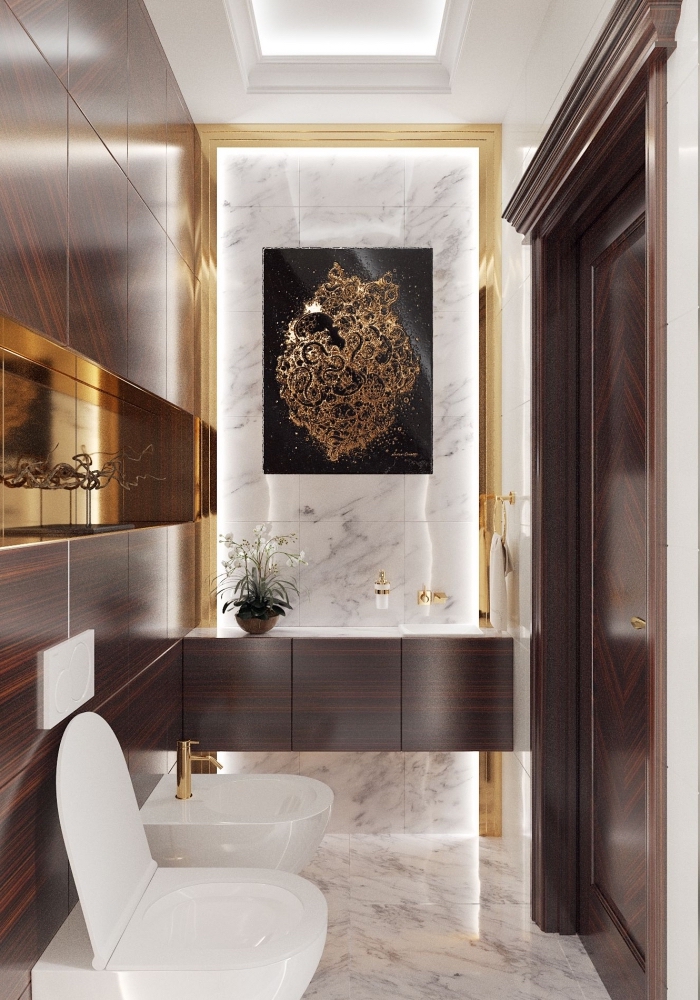 design luxueux dans toilettes avec revêtement mural marbre et bois foncé, décoration toilette avec accents dorés