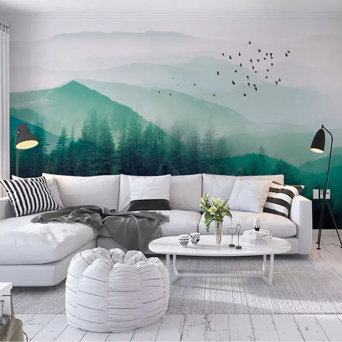 Dessin de montagne sur le mur en vert et blanc, idée salon canapé en angle blanc, peindre une chambre en deux couleurs
