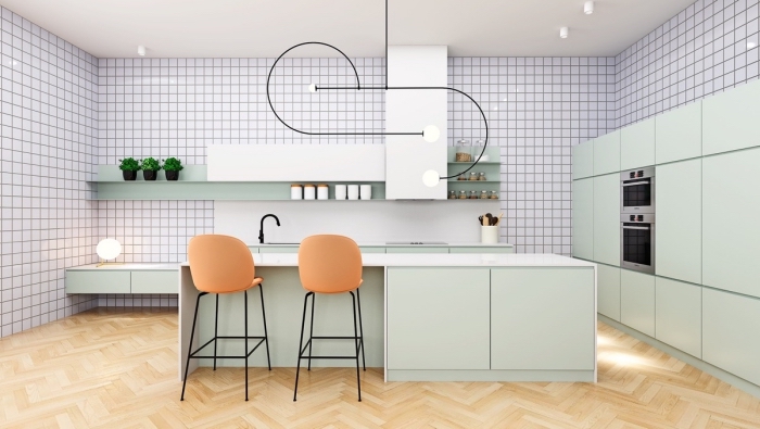 agencement cuisine en longueur avec îlot central, modèles de meubles de cuisine de nuance vert celadon avec comptoir blanc