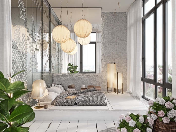 design intérieur chambre a coucher moderne aux murs gris clair avec grands fenêtres et un lit au sol cocooning