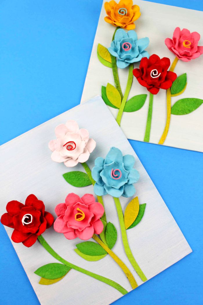 boite d oeud recyclée pour fabriquer une composition décorative de fleurs artificielles sur papier blanc