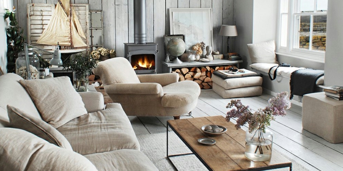 ambiance cosy salon chaleureux tapis cocooning canapé beige claire cheminée foyer ouverte