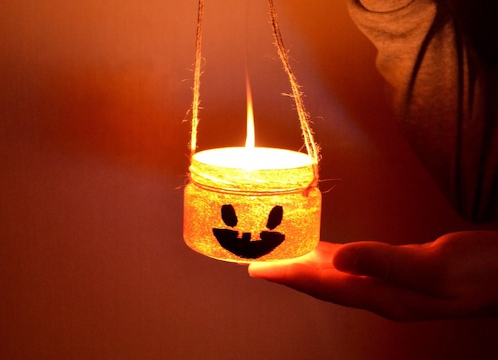 idée de photophore de halloween a faire soi meme bricolage halloween facile avec pot en verre motif jack o lantern