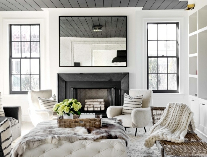 salon blanc et noir déco cocooning salon tapis originale idee douillet cheminée noire chaise blanc table basse jetée fausse fourrure