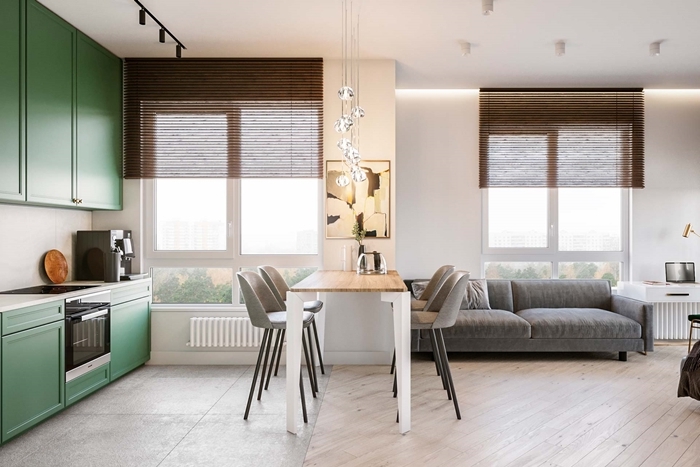 deco petit appartement moderne petite cuisine en longueur meubles haut vert crédence blanche table îlot blanc et bois