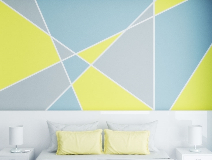 deco chambre peinture formes triangulaires spots led éclairage meuble de chevet blanc lampe de chevet coussin oreillers jaune