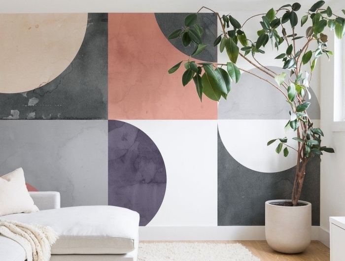 peinture géométrique design salon moderne revêtement de sol parquet bois tapis moelleux blanc canapé d angles blanc