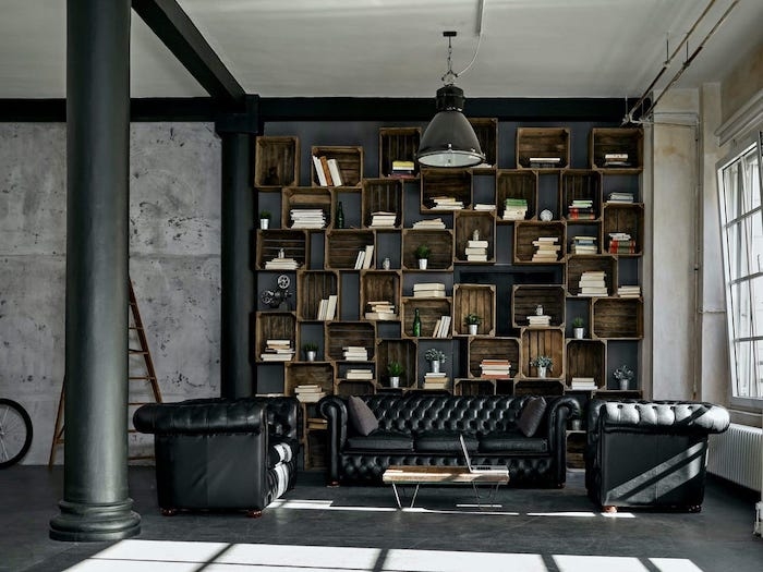 déco intérieur moderne un salon avec des canapés en cuir et une biblioteque rustique et une table basse